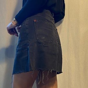 Washed-black denim skirt.